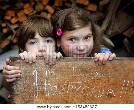 preteen siblings boy and girl close up photo playing in self organised happy baby club