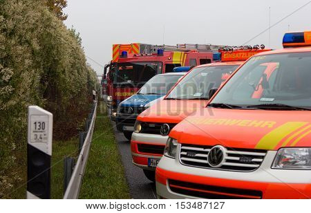 HANNOVER / GERMANY - OCTOBER 25 2016: german emergency service cars stands in a row on freeway a2 by a truck crash near Hannover.