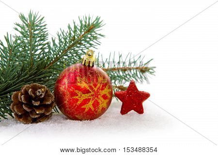 Christmas background with red bauble and green fir tree bransh .Christmas decoration.