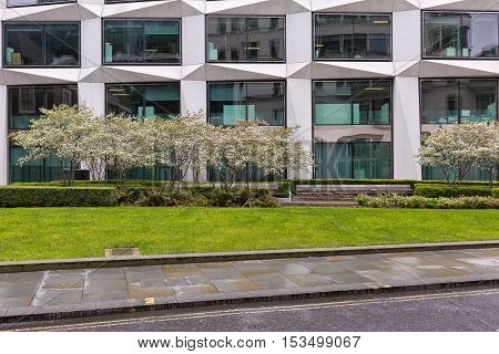 London United Kingdom - April 2016: Cropped street view of a commecial office building. Frontal facade