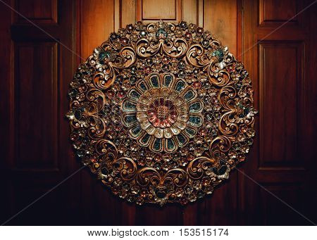 the beautiful antique circle shape of art object decorate on wooden wall background