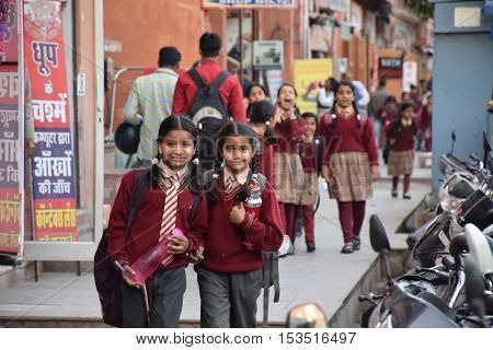 JAIPUR, RAJASTHAN, INDIA - FEBRUARY 05, 2016 - Indian kids in uniform smiling at the camera before going to school