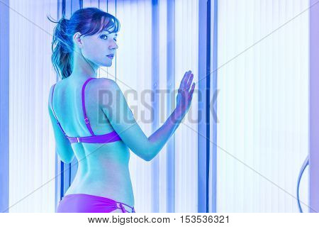 Pretty Slim Woman Getting Sun Tan In Solarium