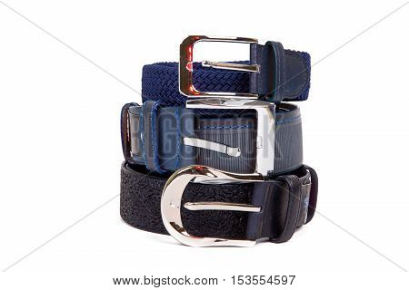 Two leather belt in a row on each other on a white background with metal clasps