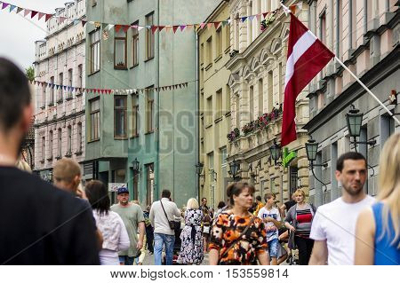 Streets in Latvia full of people in city Cesis festival.