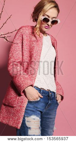 fashion studio photo of gorgeous young woman with blond hair in elegant clothes with acccessories