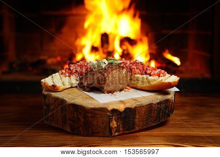 delicious piece of meat roasted on a background of fire