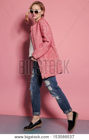 fashion studio photo of gorgeous young woman with blond hair in elegant clothes with acccessories