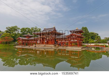 UJI JAPAN - JULY 27 2016: Phoenix Hall (Hoodo circa 1053) of Byodo-in Temple in Uji city near Kyoto. National Treasure of Japan and UNESCO site