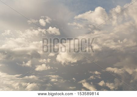 Cumulus clouds against a blue sky. Mostly Cloudy. Synoptics.
