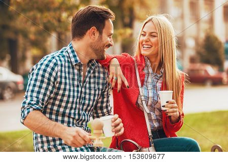 Young happy couple is playing with kendama.