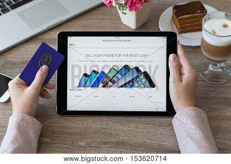 Alushta Russia - October 9 2016: Woman holding a iPad Pro with Internet shopping service eBay on the screen. iPad Pro was created and developed by the Apple inc.