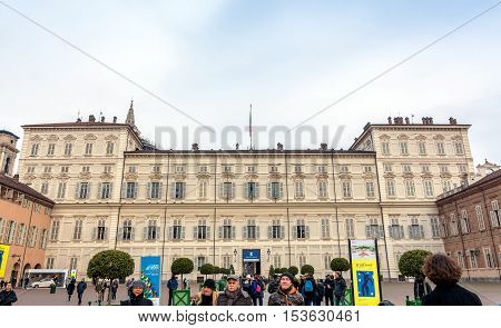 Turin Italy - December 31 2015: tourists in front of Royal Palace in Turin Italy. In 1997 it was placed on the UNESCO World Heritage Site list.