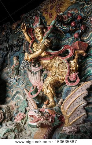 Statue of Kuixing god of fate at western hills, Yunnan, China