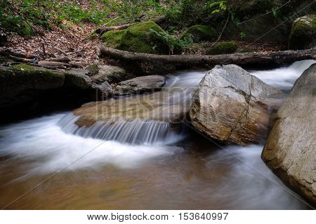 small waterfall in forest close to Sapci waterfall