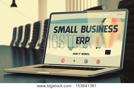 Small Business ERP - Landing Page with Inscription on Mobile Computer Screen on Background of Comfortable Meeting Room in Modern Office. Closeup View. Blurred Image with Selective focus. 3D Render.