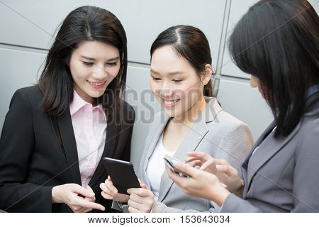 businesswoman use cell phone happily in hongkong