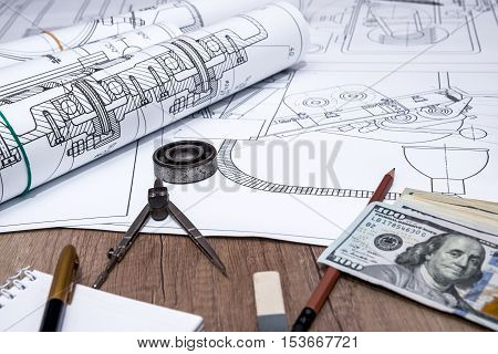 The drawing machine pencil ruler us dollar and compasses