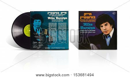 Rishon LeZion Israel-August 4 2016: Old used vinyl album Mike Burstyn Rozhinkes mit Mandlen and other great Yiddish songs. under label Hed-Arzi ‎Ltd - BAN 14784 The Israel Records Manufacturing Co.Ramat-Gan Israel in 1979