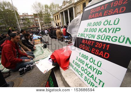 ISTANBUL,TURKEY-DECEMBER 2: Unidentified Syrians living in Istanbul protest the regime of Bashar Essad in front of Syrian Consulate on December 2, 2011 in Istanbul,Turkey.