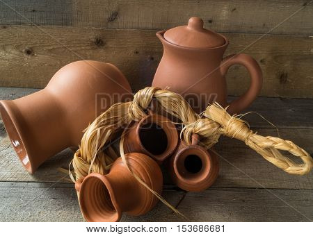 still life with jars of different sizes on an old wooden table