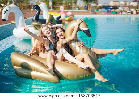 Happy girls with beverages on summer party near the pool. 20s. Slow Motion.