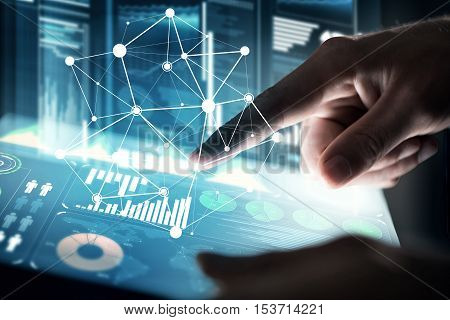 Businessman hand touching with finger virtual panel with infographs