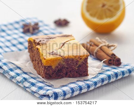 Thanksgiving treatment. Marble chocolate brownies with pumpkin. Freshly baked homemade brownie. Selective focus on the front. Horizontal.