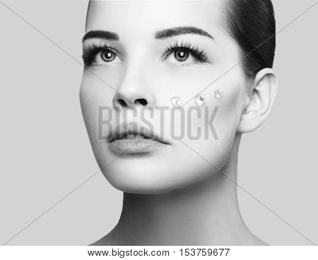 Fashion Beautiful Woman With Drops Of Gel On Another Cheek