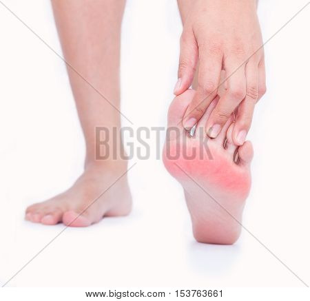Foot pain in women Woman massaging her foot.