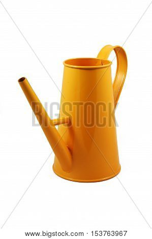 Watering can for flowers, in orange paint, made of metal, isolated on white background
