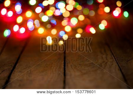 Bokeh background with colorful lights on wooden boards