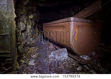 Rusty old cart in abandoned coal mine, Abkhazia