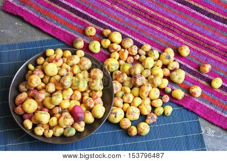 Bowl of colorful whole raw Peruvian olluco tuber vegetable