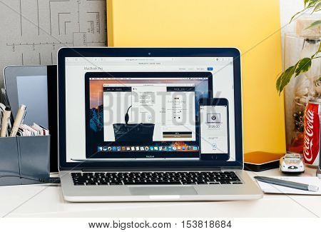 PARIS FRANCE - OCT 28 2016: Apple Computers website on new MacBook Pro Retina with OLED touch bar in a geek creative room showcasing new professional laptop - detail of Apple Pay simulated transaction
