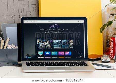 PARIS FRANCE - OCT 28 2016: Apple Computers website on new MacBook Pro Retina with OLED touch bar in a geek creative room showcasing new professional laptop - tvOS new features for even better Apple TV experience