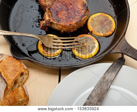 Pork Chop Seared On Iron Skillet