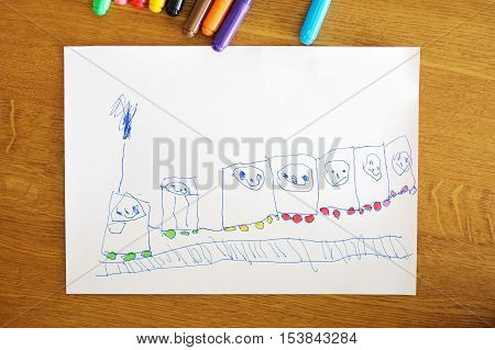 Child's drawing: happy train with happy children