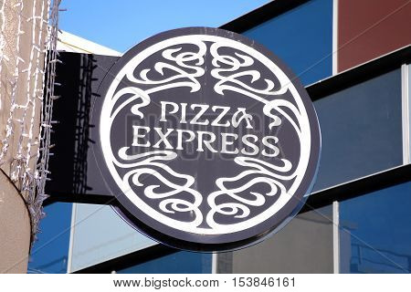 Carmarthen, Wales, UK, October 22, 2016 :  PizzaExpress logo advertising sign outside its restaurant in St Catherine's Walk