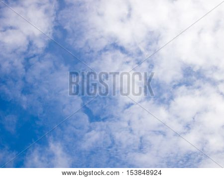 Clear blue sky with white cloud background
