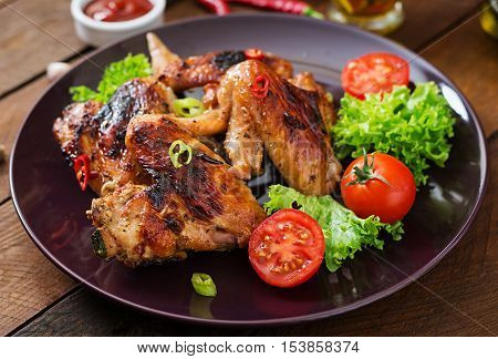 Baked Chicken Wings In The Asian Style On Plate.