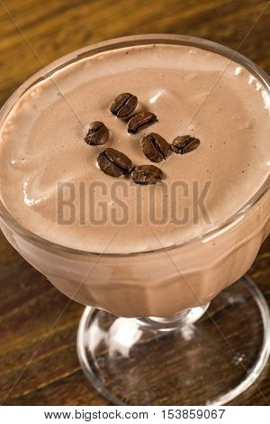 Coffee cream pannacotta selective focus. Wood background.