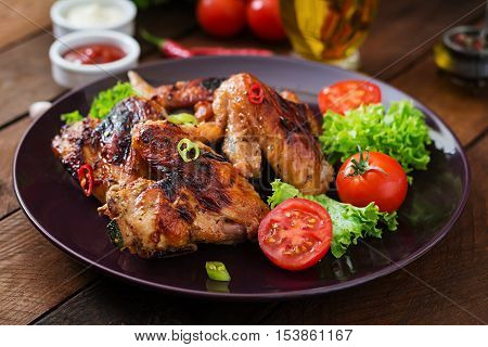 Baked Chicken Wings In The Asian Style On Plate.