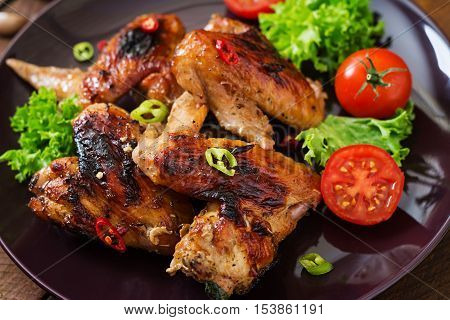 Baked Chicken Wings In The Asian Style On Plate.