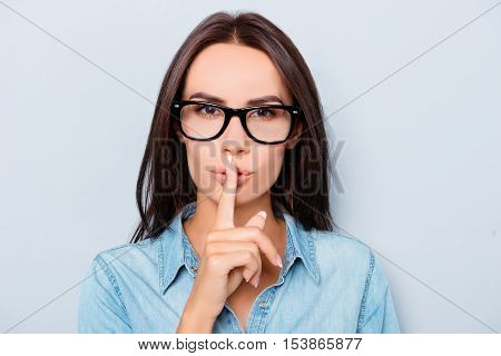 Shh! Pretty Woman In Glasses Showing Silent Gesture