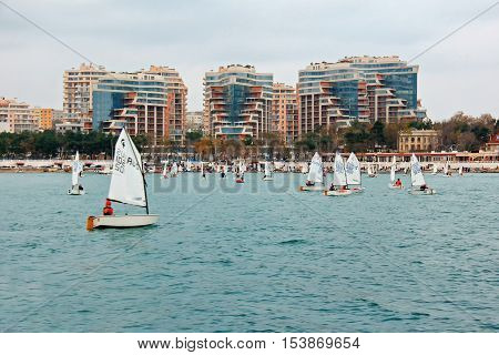 GELENDZHIK, RUSSIA - NOVEMBER 7, 2015: Sailing sport in in sunny day on Black sea coast on November 7, 2015 in city-resort Gelendzhik, Russia