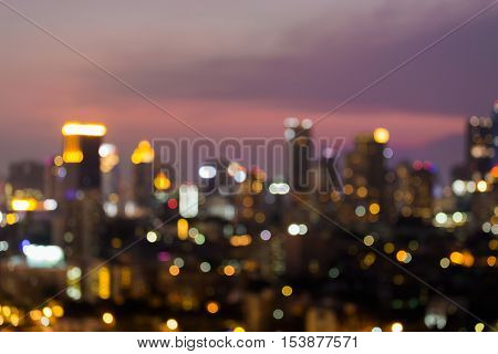 Blurred bokeh light city downtown night view, abstract backgroundNight blurred lights office building downtown, abstract background