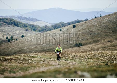Privetnoye Russia - September 21 2016: male riders cyclist rides on a mountain trail mountain bike during Crimean race mountainbike