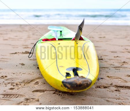 Multicolored canoe on the beach, selective focus.