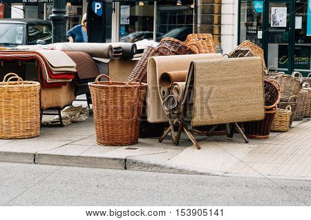 Cirencester UK - August 17 2015: Wicker baskets and rugs in the Market Place of Cirencester. The city is a market town in the cotswolds and is known to be an important early Roman area.